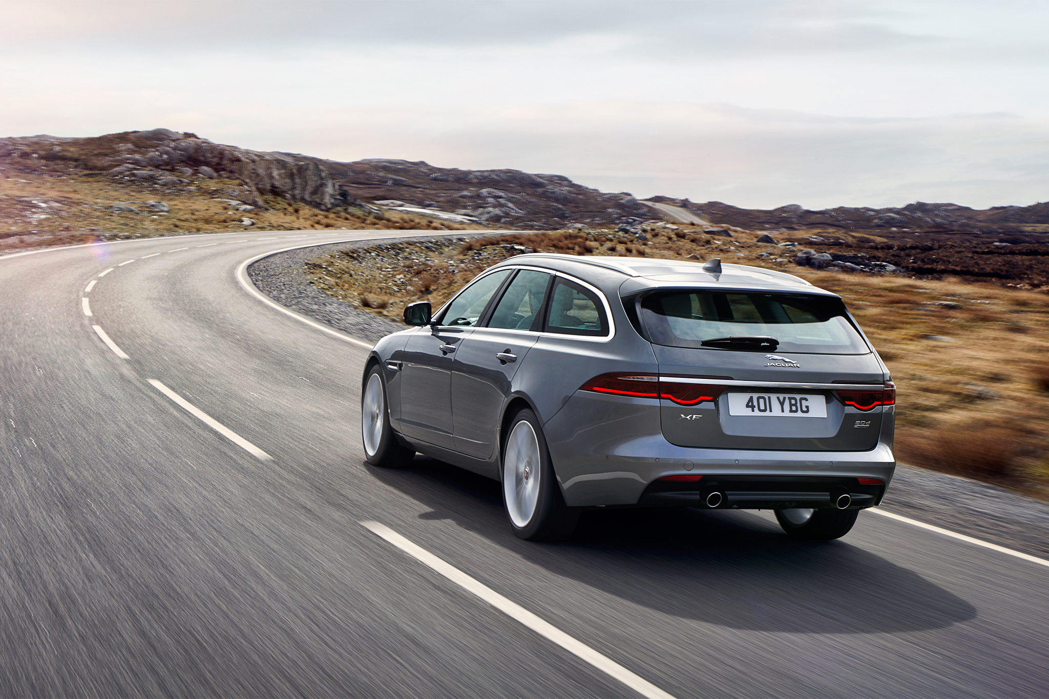 2018-Jaguar-XF-Sportbrake-rear-three-quarter-in-motion-09.webp