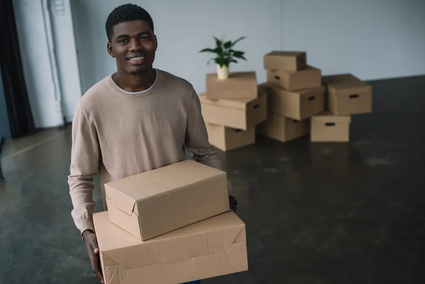 Student-packing-boxes-before-leaving-for-university.webp