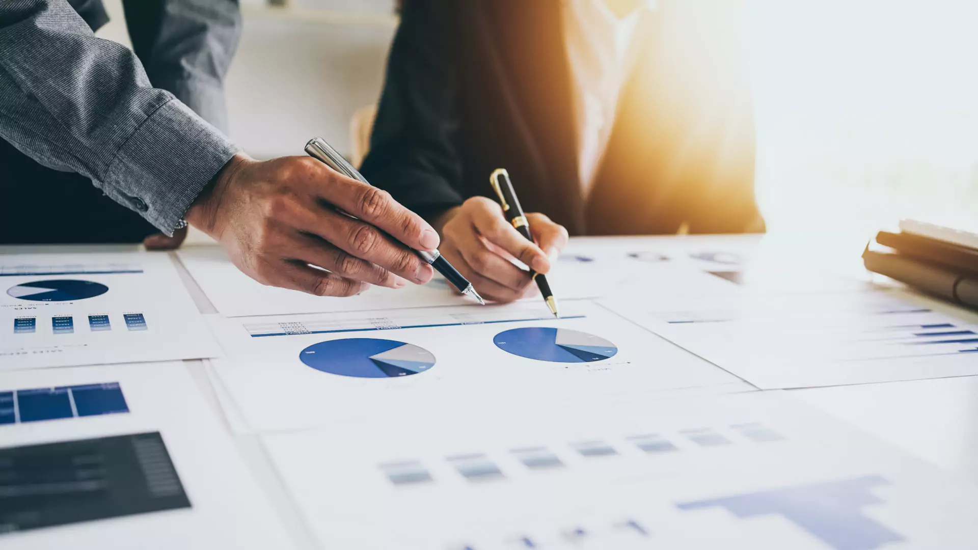 businesswoman-supervisor-pointing-graph-during-analysis-company-sales-plan-office.webp